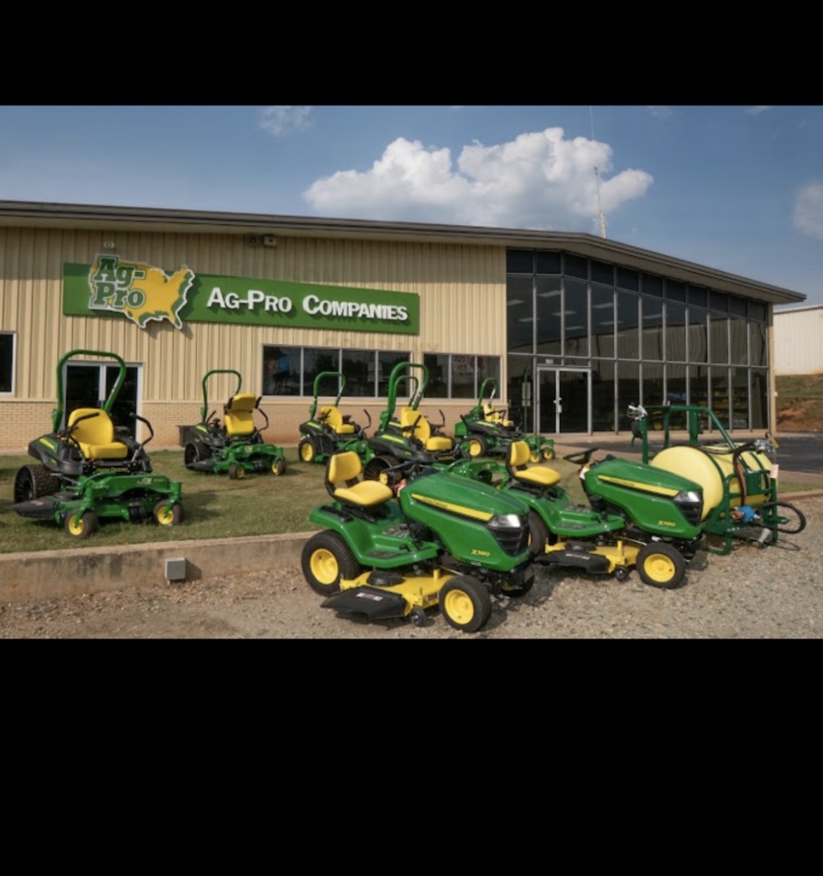 Ag-Pro Spartanburg storefront with green John Deere mowers outside